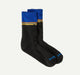Black socks with blue and yellow striped cuffs on a white background