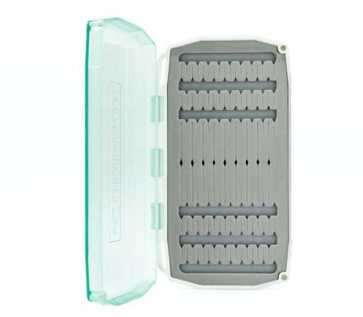 Aqua-colored Umpqua UPG Foam Flats fly box open to show the slit foam insert for saltwater flies.