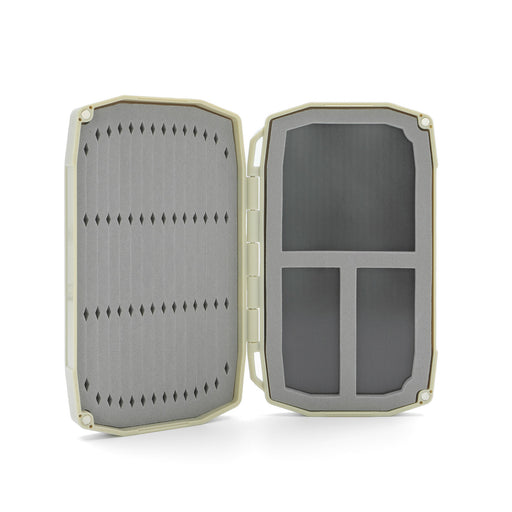 Open tan Umpqua Tailwater Mini Foam fly box showing the micro-slit foam side and magnetic insert compartments.