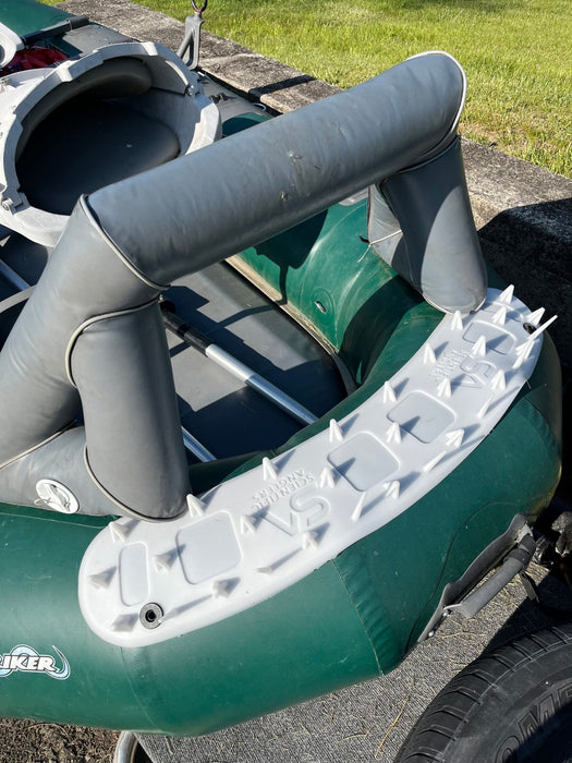 Scientific Anglers Launch Pad fly line casting mat secured neatly on the bow deck of a green drift boat