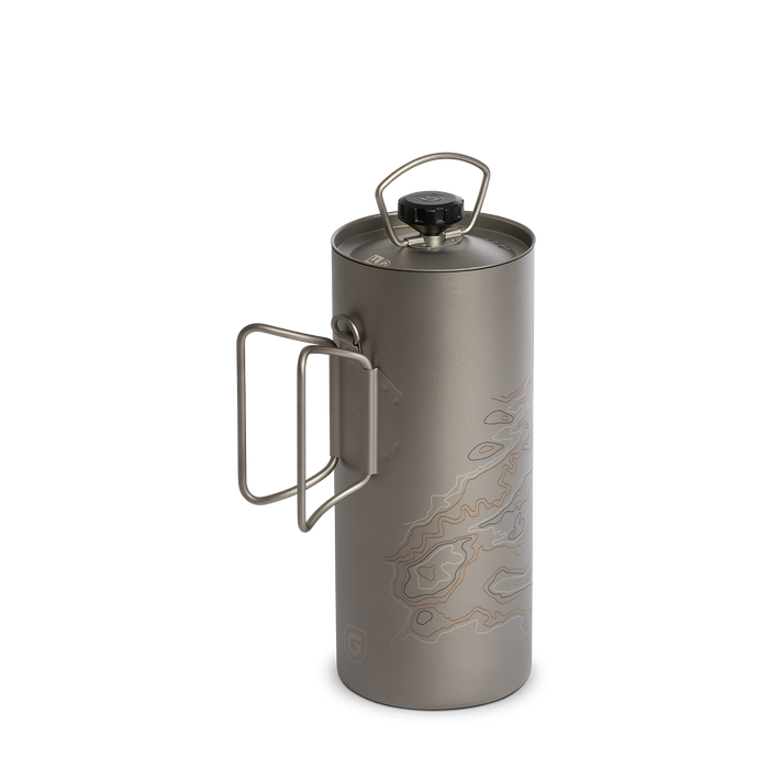 Side profile of the Grayl 24oz GeoPress Ti Purifier bottle showcasing the flush-folded titanium butterfly handles and sleek outdoor design