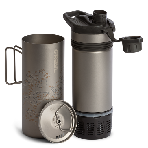 Grayl 24oz GeoPress Ti Purifier disassembled showing the outer titanium cup, inner press sleeve with filter cartridge, and drink cap