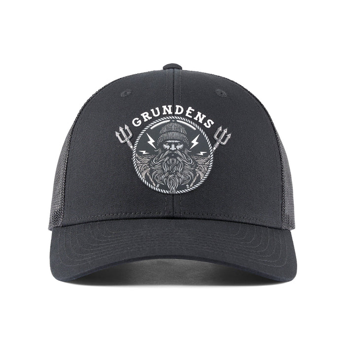 Grundens Sentinel of the Seas Trucker Hat in Black featuring a detailed mythical ocean guardian front patch