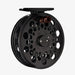 Black fly fishing reel on a white background