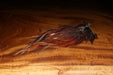 Brown dyed over white Hareline Rooster Saddle patch showing the flexible stems and soft streamer hackle fibers.