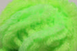 A close-up view of Hareline Easy Egg Chenille in Fl. Chartreuse #127, highlighting the fuzzy, high-visibility neon green-yellow fibers designed for turbid water fishing.