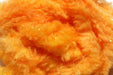 A close-up view of Hareline Easy Egg Chenille in Peach #281, showcasing the soft, warm pastel orange-pink fibers that replicate real trout and salmon egg roe.
