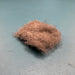 A close-up view of Fulling Mill CDC Dubbing in Natural Grey, showing the premium, fluffy Cul de Canard fibers ideal for realistic, high-floating dry fly bodies.