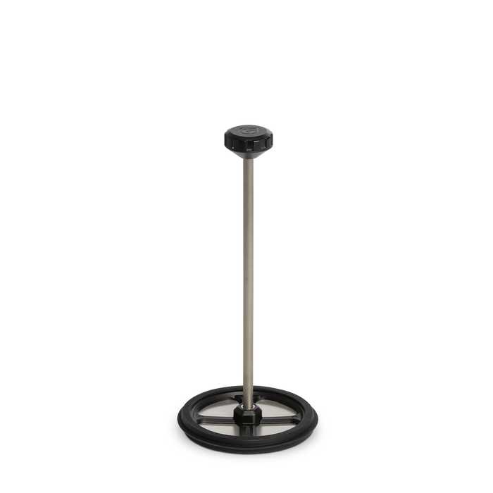 Side profile view of the fully assembled Grayl Titanium Coffee Press plunger mechanism demonstrating the connected multi-piece titanium stem and filter disc