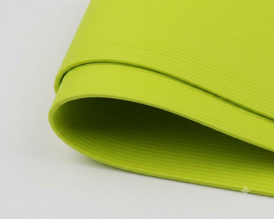 A package of Hareline Round Rubber Medium legs in Chartreuse #54, showcasing vibrant, neon chartreuse-green round rubber strands for high-visibility attractors and bass bugs.