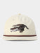 Beige cap with an alligator design on a white background