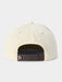 Beige cap with a brown adjustable strap on a light gray background