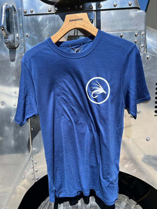 Clement Blue Patagonia Capilene Cool Merino Blend Shirt showing the circular Golden Fly Shop logo on the left chest.