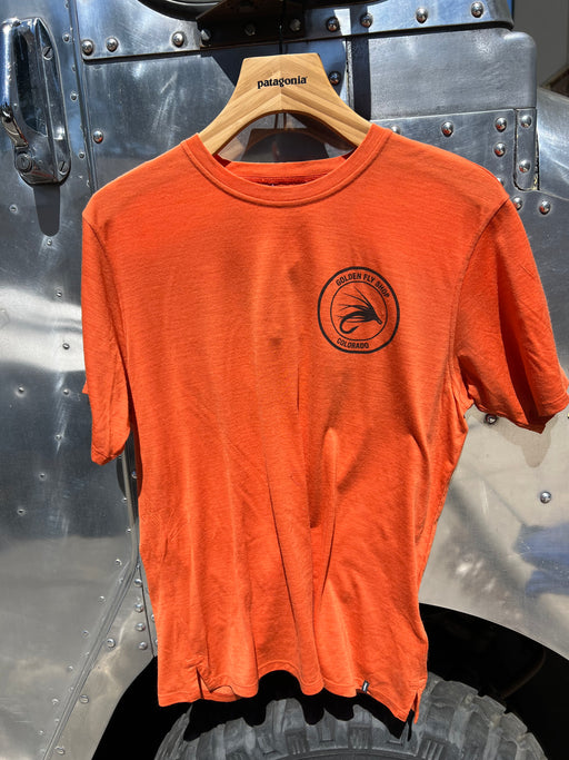 Coal Orange Patagonia Capilene Cool Merino Blend Shirt featuring the circular Golden Fly Shop Colorado chest logo.