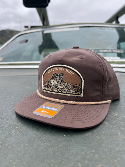 Dark Mocha flat bill variant of the Golden Fly Shop Underwood Brown Trout Hat 2026 featuring a dark brown crown, flat visor layout, and illustrated brown trout patch