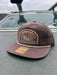 Dark Mocha flat bill variant of the Golden Fly Shop Underwood Brown Trout Hat 2026 featuring a dark brown crown, flat visor layout, and illustrated brown trout patch