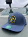 Golden Fly Shop Back Nine Hat Sea Blue 2026 edition structured performance cap made from recycled materials featuring a circular gold embroidered fly silhouette patch