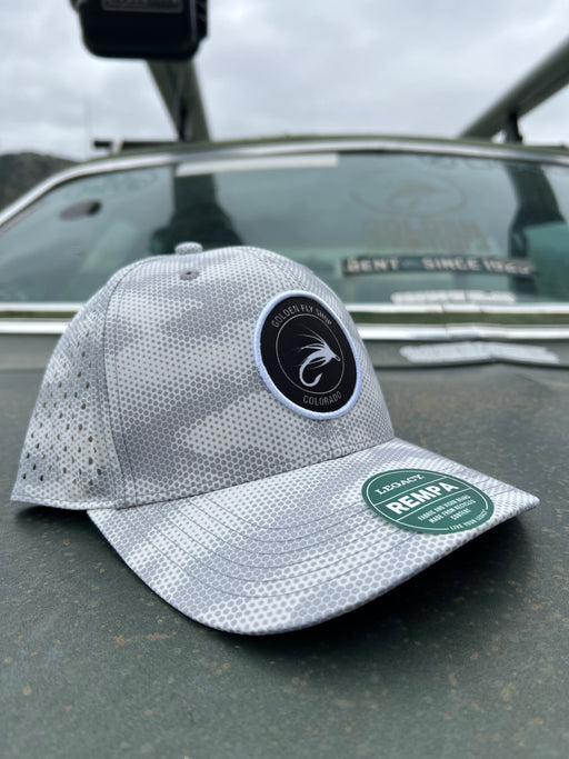 Golden Fly Shop Hat Grey Camo Dots 2026 edition technical performance cap featuring a circular embroidered trout logo patch on a Legacy REMPA frame