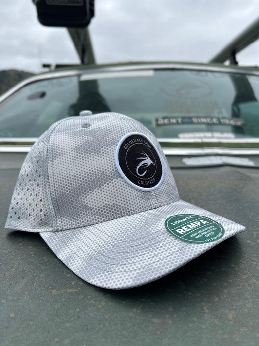 Golden Fly Shop Hat Grey Camo Dots 2026 edition technical performance cap featuring a circular embroidered trout logo patch on a Legacy REMPA frame