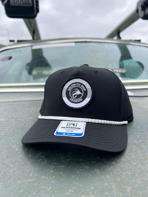 Golden Fly Shop 258 Hat Black w/ White Rope 2026 edition structured Richardson performance cap featuring a circular embroidered fly logo patch and Stay-Dri fabric