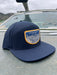 Golden Fly Shop Hat Underwood Solid Navy 2026 edition 7-panel performance cap with laser-perforated mesh and a custom embroidered trout illustration patch