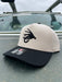 Golden Fly Shop Simple Logo Hat Cream Black 2026 edition structured Richardson snapback cap featuring a large black embroidered fly silhouette logo