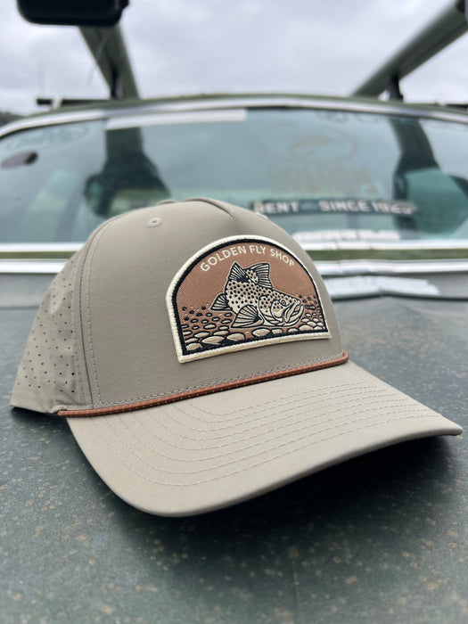 Solid Trenchcoat variant of the Golden Fly Shop Underwood Brown Trout Hat 2026 showcasing a tan khaki crown, matching mesh back, and large illustrated brown trout patch