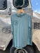 Blue Sage Patagonia Cap Cool Ultra Hoody displaying the circular Golden Fly Shop Colorado logo on the right chest