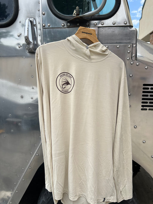 Pumice Dyno White Patagonia Cap Cool Ultra Hoody hanging up, showcasing the lightweight honeycomb airflow architecture