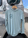 Light Thermal Blue Patagonia Women's Capilene Cool Daily Hoody featuring the circular Golden Fly Shop Colorado logo on the right chest