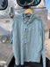 Front profile of the Blue Sage Patagonia River Rambler Hybrid Sun Hoody demonstrating the casual button-down collar layout with the hood removed