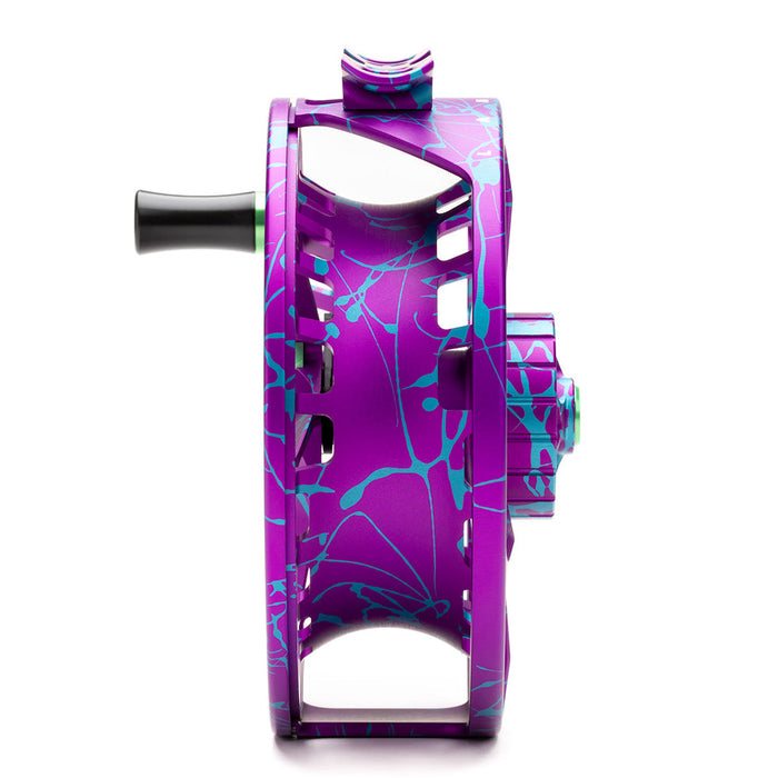 Side profile view of the Lamson Litespeed M Wild Child Special Edition fly reel displaying the narrow spool width and green handle accent piece