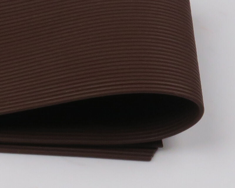 A package of Hareline Round Rubber Medium legs in Brown #40, showing a dense bundle of matte brown round rubber strands ideal for stoneflies and crayfish patterns.