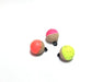 Three CorQs natural cork fly fishing strike indicators in high-visibility neon pink, orange, and chartreuse.