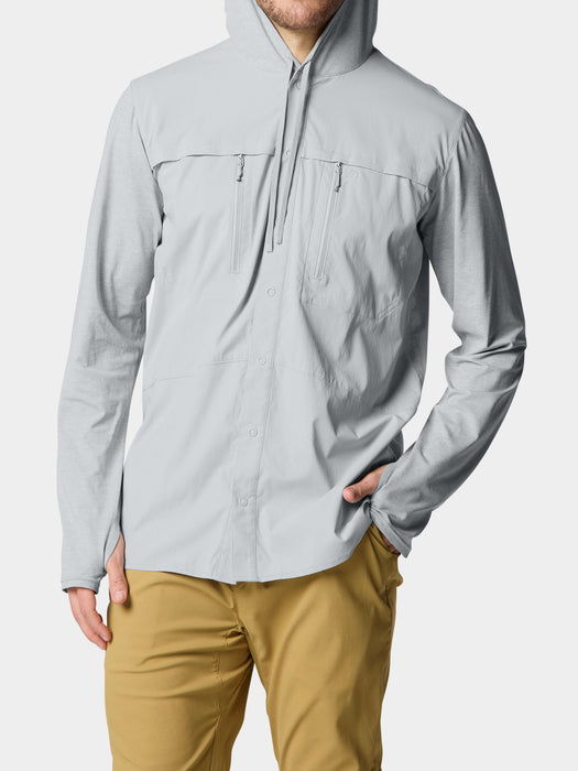 Model wearing the Duck Camp Hybrid Guide Hoodie in Highrise grey to show the technical fit for fly fishing.