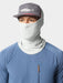 Angler wearing the Highrise grey Duck Camp Brrr Rockport Gaiter sun mask pulled up with a technical fishing hat.