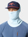 Angler wearing the Ice Water blue Camp Brrr Rockport Gaiter sun mask pulled up with a technical fishing hat.