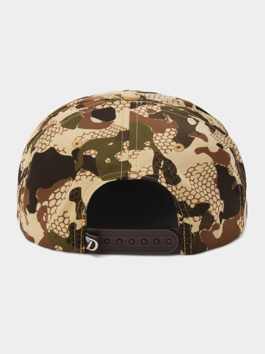 The back of a structured snapback cap featuring a complex camouflage pattern with scales, honeycomb, and organic shapes in beige, brown, green, and black, with a dark brown adjustable strap.