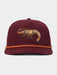 A maroon structured baseball cap featuring an embroidered orange and yellow prawn on the front, with a contrasting orange rope detail across the visor, set against a light gray background.
