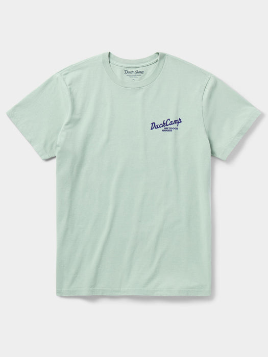 Front view of the Duck Camp Goods and Gear Tee in Bay light green, featuring the custom Duck Camp Outdoor Goods chest logo