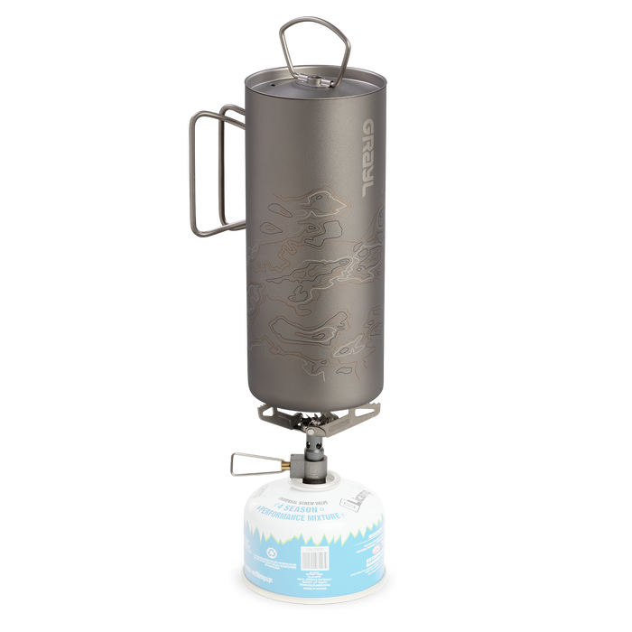 Grayl 24oz GeoPress Ti Purifier outer titanium cup placed directly over a burning backpacking camp stove to boil water in the field