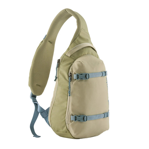 Beige sling bag with blue straps on a white background