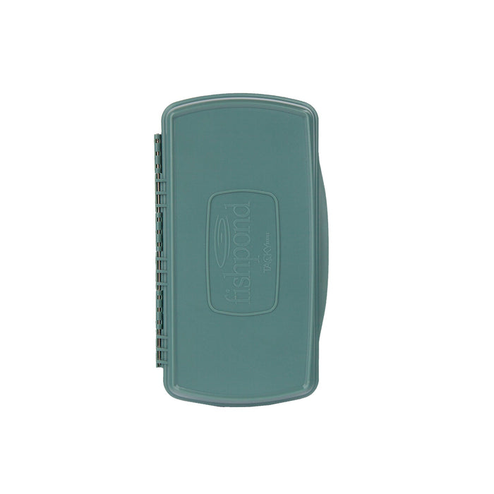 Closed view of the eco-friendly Fishpond Pascador Large Fly Box in sage green showing the molded logo.
