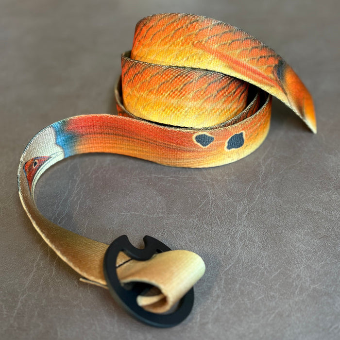 Copper-colored Redfish skin spot pattern DRIFT Reversible Webbing Belt with a durable polyester strap.