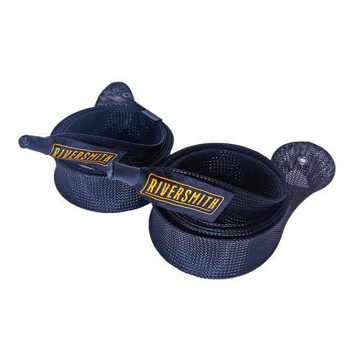 A pair of navy blue Riversmith Rig Wraps Fly Rod Sleeves coiled together showcasing the gold embroidered Riversmith logo and woven braid pattern