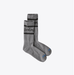 Pair of gray socks with black stripes and Patagonia branding on a white background