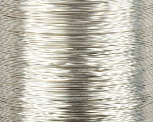 A close-up view of a spool of UNI-Soft Wire X-Small Silver #344, displaying the ultra-fine, highly reflective metallic silver wire wound tightly on the spool.