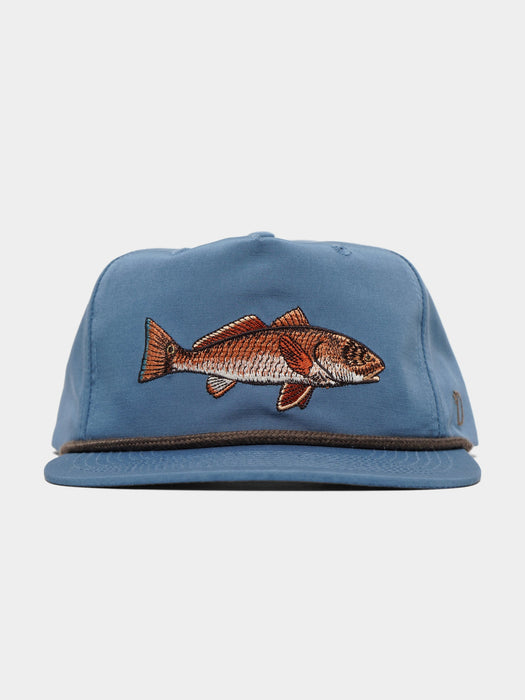 Front view of the Duck Camp Redfish Hat in Coastal Blue, featuring a detailed copper and white embroidered redfish patch on the front panel, a dark brown cotton rope accent across the brim, and an adjustable 5-panel structured frame.