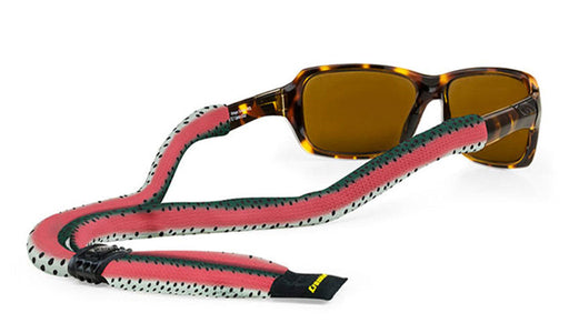 Croakies Suiters Collection Prints eyewear retainer in Rainbow Trout Fish Skin pattern, showcasing a soft knitted strap with an iconic pink lateral stripe and fine dark spots secured to sunglasses.
