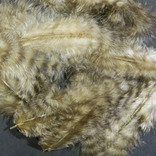 A close-up of Hareline Grizzly Marabou feathers in Tan #369, showcasing soft, sandy tan fibers detailed with light brown and cream barred grizzly variegation.